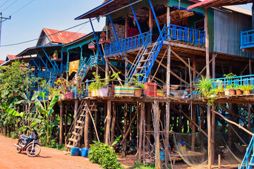 SIEM REAP, CAMBODIA - APRIL 28, 2022: KAMPONG PHLUK FLOATING VILLAGE during the dry season on a hot...