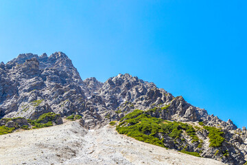 Dangerous falling rocks and stone avalanche from the mountain Austria.