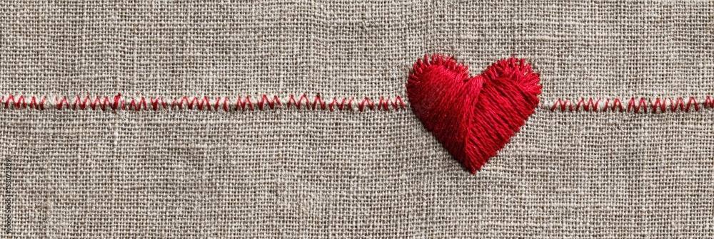 Poster red thread stitched heart on textured linen creates a simple yet elegant craft design perfect for de