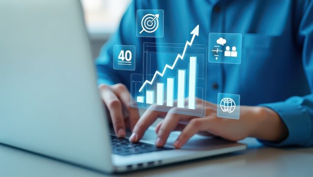 Person working on a laptop with projected business graphs.
