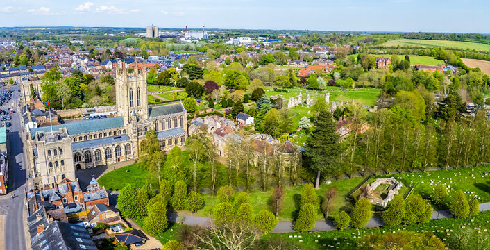 A panorama aerial view over the Abbey Gardens, cathedral, and town at Bury Saint Edmunds on a bright day in springtime