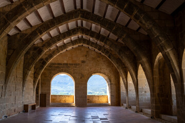 Medieval castle and church interior in Valderrobres, Teruel. Gothic architecture, historic ambiance, and rustic charm.