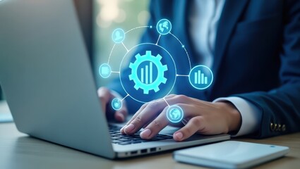 Person working on a laptop with digital interface overlay.