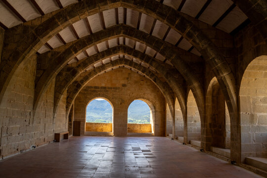 Medieval castle and church interior in Valderrobres, Teruel. Gothic architecture, historic ambiance, and rustic charm.