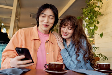 Joyful moments shared by multicultural friends in a cozy cafe environment