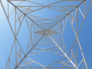 Electric transmission towers are part of the electric power system used to distribute electricity from power plants to substations and then to consumers.