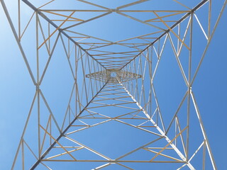 Electric transmission towers are part of the electric power system used to distribute electricity from power plants to substations and then to consumers.