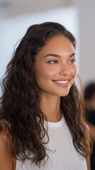 Attractive woman smiles and looks to the side. Portrait of smiling girl, natural beauty, fresh face, young adult, healthy lifestyle.