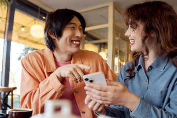 Friends sharing laughter and stories in a vibrant cafe setting