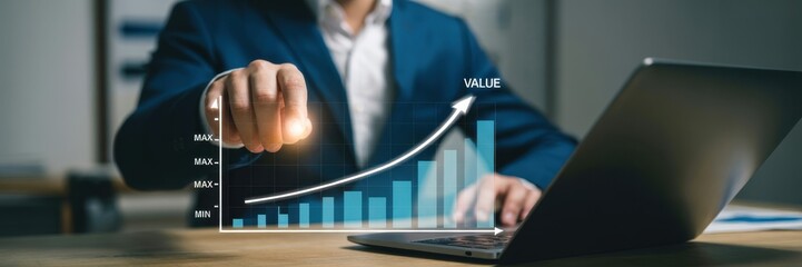 Businessperson interacting with a graphical representation of growing value.