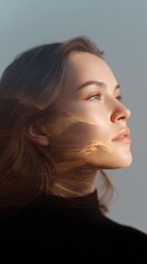 Woman's face is overlaid with a desert landscape at sunset. Double exposure, natural beauty, artistic portrait, imagination, daydreaming