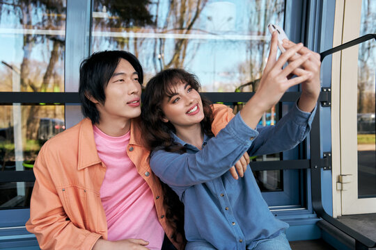 Moments of happiness shared between multicultural friends in a cozy cafe setting