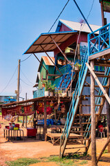 SIEM REAP, CAMBODIA - APRIL 28, 2022: KAMPONG PHLUK FLOATING VILLAGE during the dry season on a hot sunny day. Post covid-19 pandemic landscape.