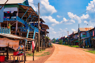 SIEM REAP, CAMBODIA - APRIL 28, 2022: KAMPONG PHLUK FLOATING VILLAGE during the dry season on a hot...