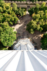 A scenic view of the Petřín Tower in Prague, surrounded by lush greenery and a well-maintained...