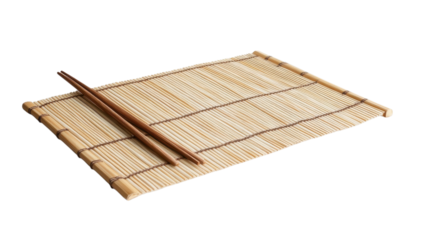 A bamboo sushi mat and chopsticks are set up for an upcoming sushi-making session in a minimal space