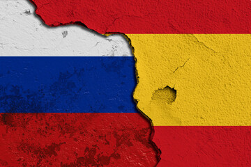 Cracked Wall Featuring Combined Flags of Spain and Russia. Image depicting a cracked wall painted...