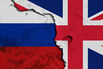 Fototapeta premium Cracked Wall Featuring Combined Flags of United Kingdom and Russia. Image depicting a cracked wall painted with the flags of United Kingdom and Russia, symbolizing a divided cultural connection.