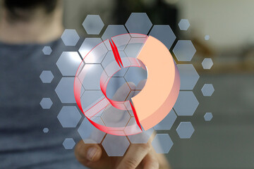 Person interacts with a 3D pie chart on a touchscreen device, showcasing data analysis.