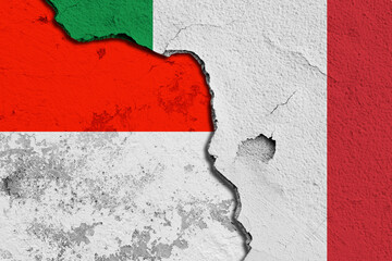 Cracked Wall Featuring Combined Flags of Italy and Indonesia. Image depicting a cracked wall...