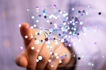 Abstract image of a hand interacting with a complex network of interconnected nodes, representing...