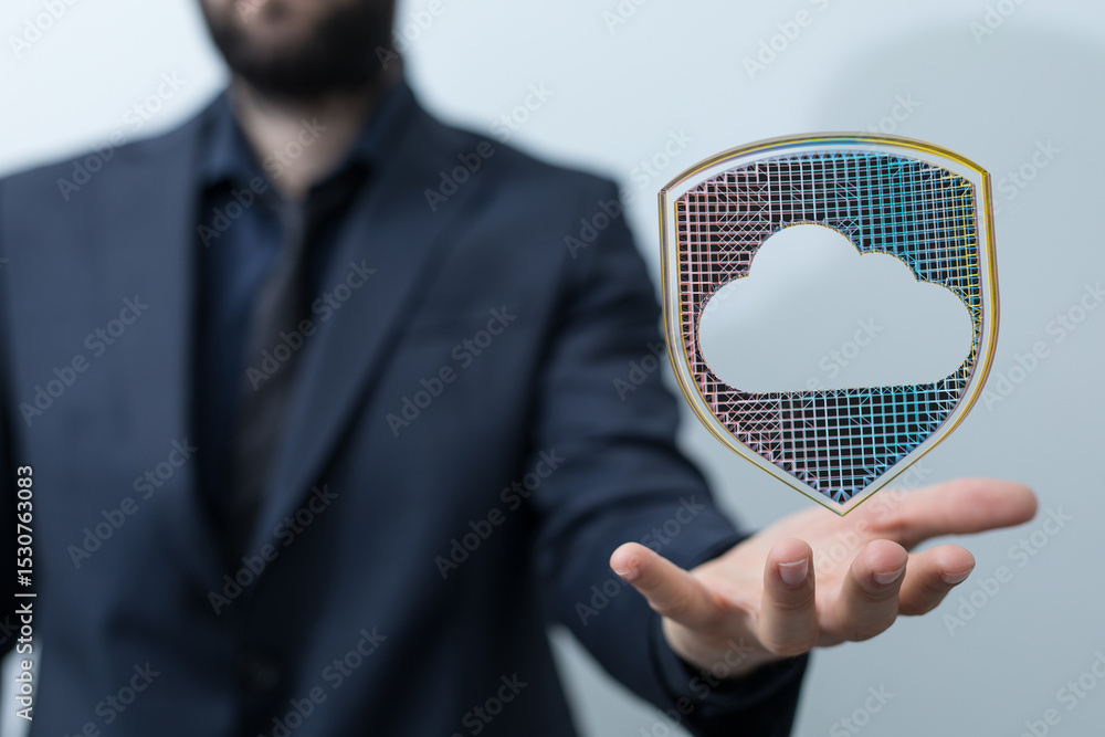 Poster image of a businessman holding a digital shield protecting cloud data, symbolizing cybersecurity and