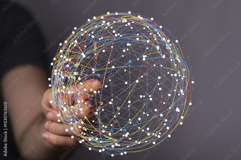Poster hand interacting with a digital sphere, visualizing global network connections and data flow.