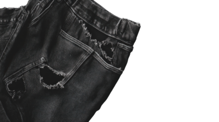Black jeans featuring distinct rips and distressing, highlighting a trend in contemporary casual clothing styles