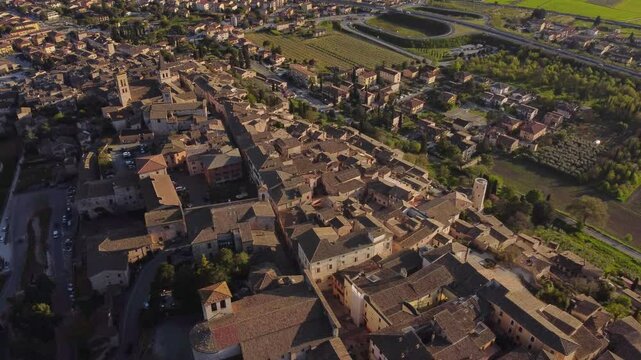 Aerial circle pan view of Spello's village, Umbria, Italy, sunny, 4k
