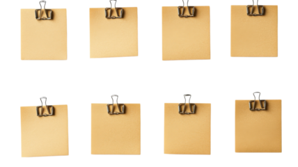 Blank sticky notes secured with binder clips create a tidy setup for tasks or reminders