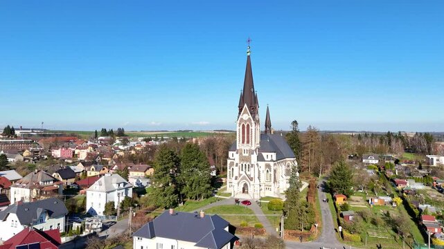 Aerial tracking orbit of Vitkov church complex framed by sky and landscape, Czech Republic