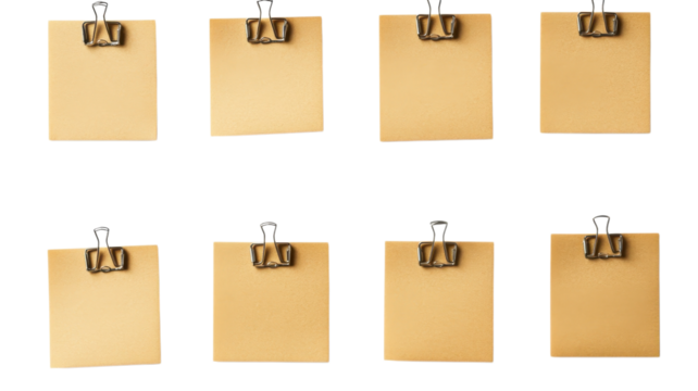 Blank sticky notes secured with binder clips create a tidy setup for tasks or reminders