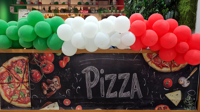 Warsaw, Poland - June 10, 2025: Colorful pizza stall with Italian flag balloons and vibrant decorations