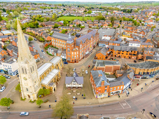 An aerial view over the centre of the town of Market Harborough, UK on a bright day in springtime