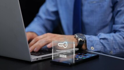 Man typing his password and verification to a two steps authentication on laptop - Powered by Adobe