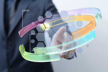 A businessman interacts with a transparent holographic display showing dynamic data charts and graphs.
