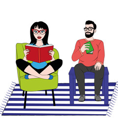 Mujer y hombre leyendo un libro.
