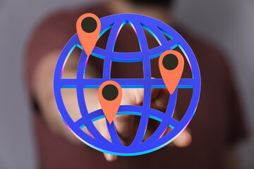 Person interacting with a 3D globe showing multiple location pins.  Represents global reach,...