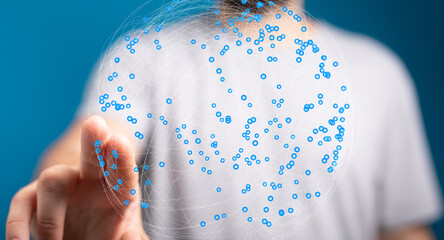 Abstract image of a person interacting with a digital network sphere.  Represents global...