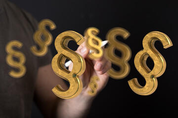 Hand drawing golden paragraph symbols, legal concept, law, justice, contract.