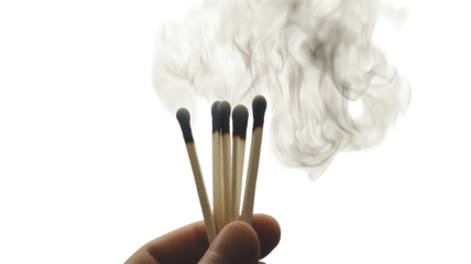 A hand holds extinguished matches, smoke curling up from their tips