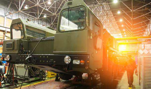 Production of military vehicles at Wheel Tractor Plant showcasing assembly processes and equipment details