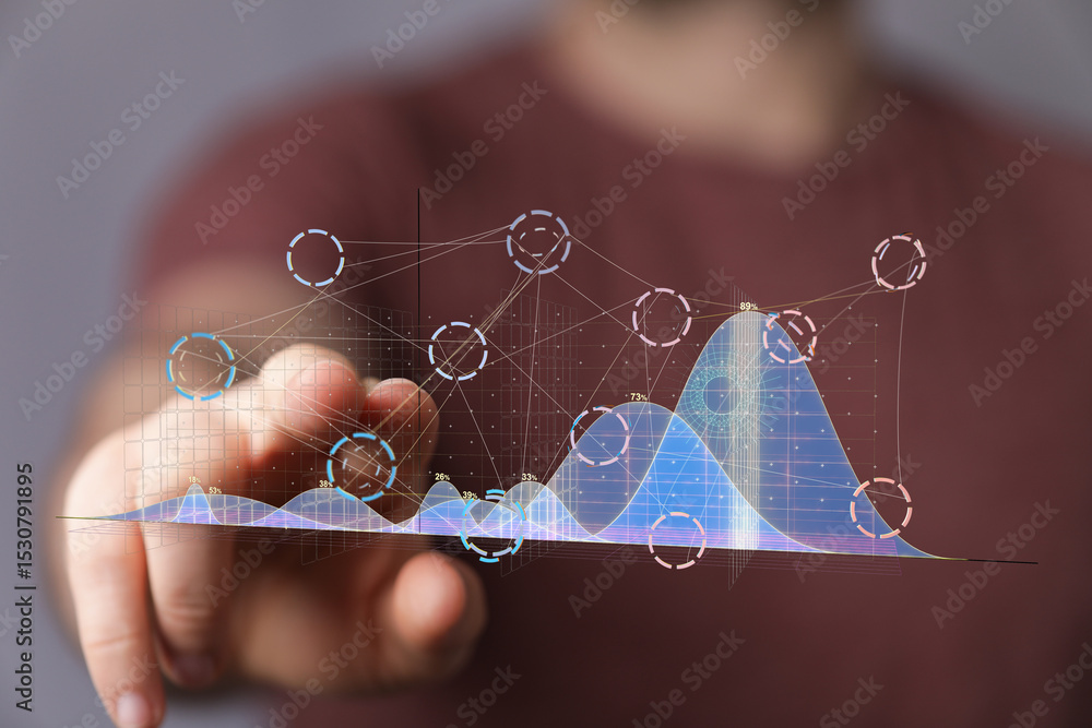 Poster Person interacts with a digital graph showing data trends and analysis.  Modern technology concept.