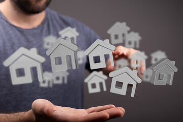 Person using a digital interface to view home options.  Real estate, property search, home buying.
