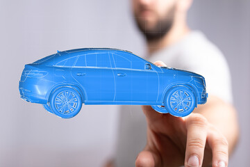 Futuristic blue SUV model in hand.  Perfect for technology, automotive, and design concepts.