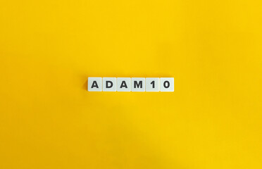 ADAM10 Medical Concept on Letter Tiles with Minimal Yellow Background