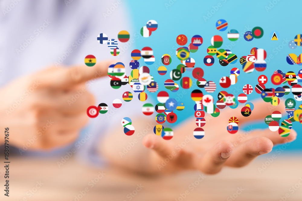 Poster image of hands holding many flags, symbolizing global unity and international connections.