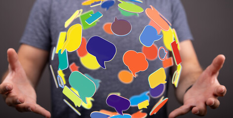 Image of person holding colorful speech bubbles, representing global communication and social media.