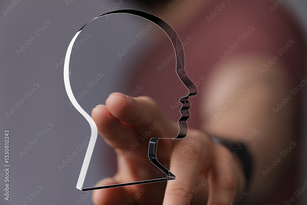 Poster abstract image of a hand interacting with a translucent head profile, symbolizing ideas, mind, or id