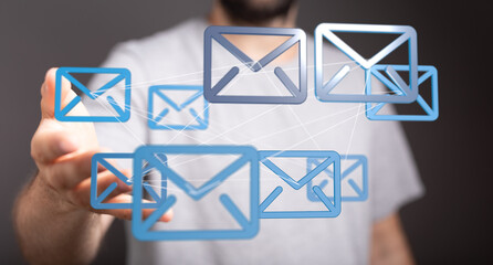 Man interacting with digital email icons, representing global communication and networking.